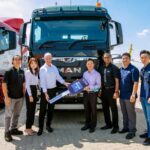 MAN Msia MD Andrew O’Brooks handing over a mock key to Vertex Mission director Andrew Tan