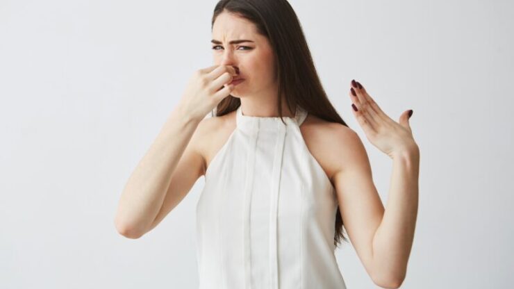 young-brunette-girl-closing-covering-nose-bad-smell